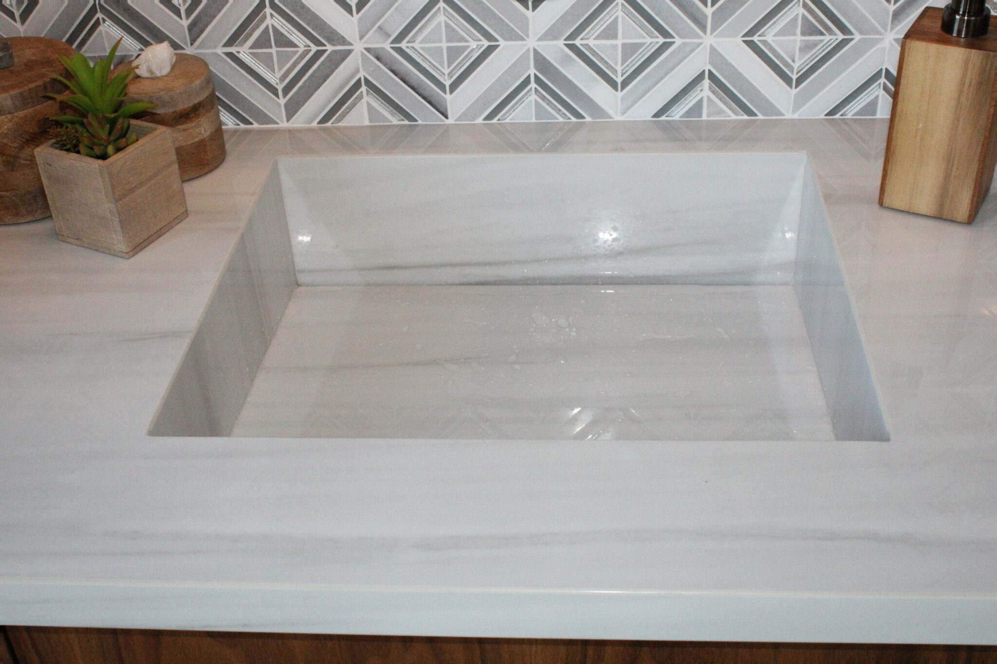 Up close integrated sink made from large format porcelain
